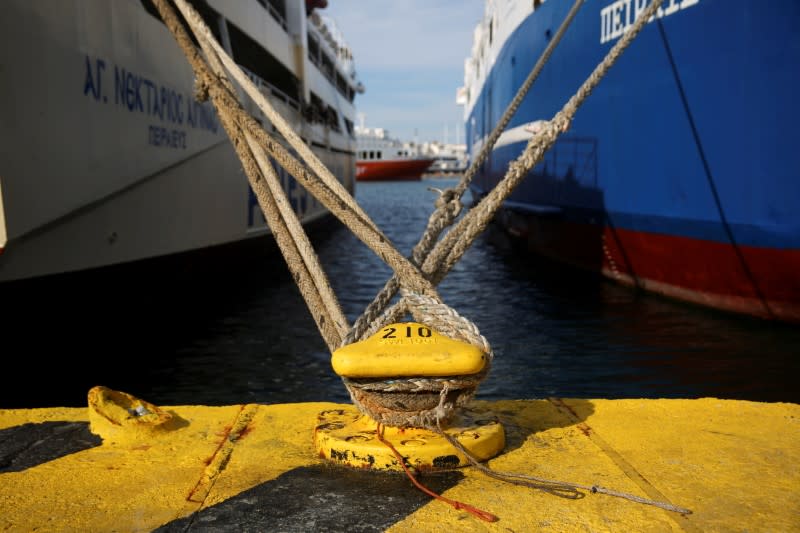 Passenger ships are moored during a 24-hour strike, at the port of Piraeus