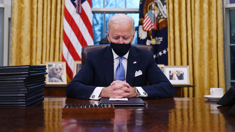 US President Joe Biden sits in the Oval Office at the White House in Washington, DC, after being sworn in at the US Capitol on January 20, 2021. (Jim Watson/AFP via Getty Images)