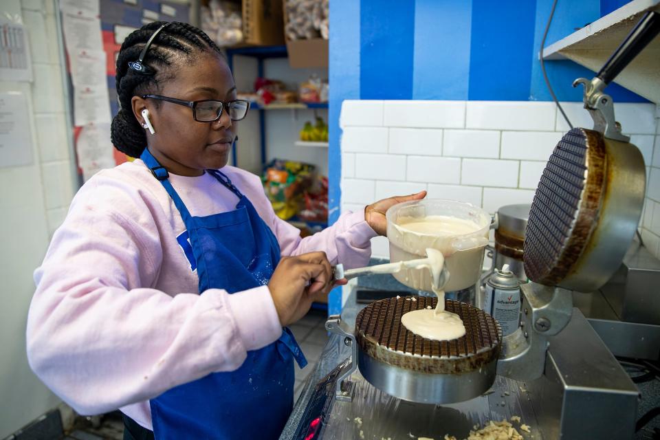 Sanai Mavindidze, a manager at Ritter's Frozen Custard, makes waffle cones Tuesday, March 29, 2022, on the northwest side of Indianapolis. 