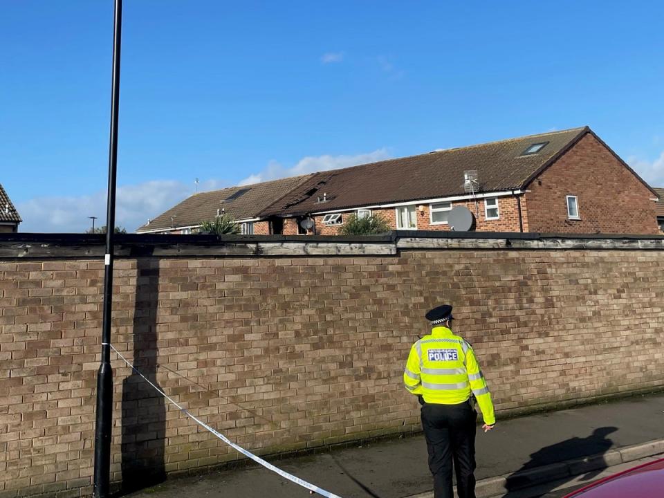 Police at the scene of the fire in Hounslow (PA)