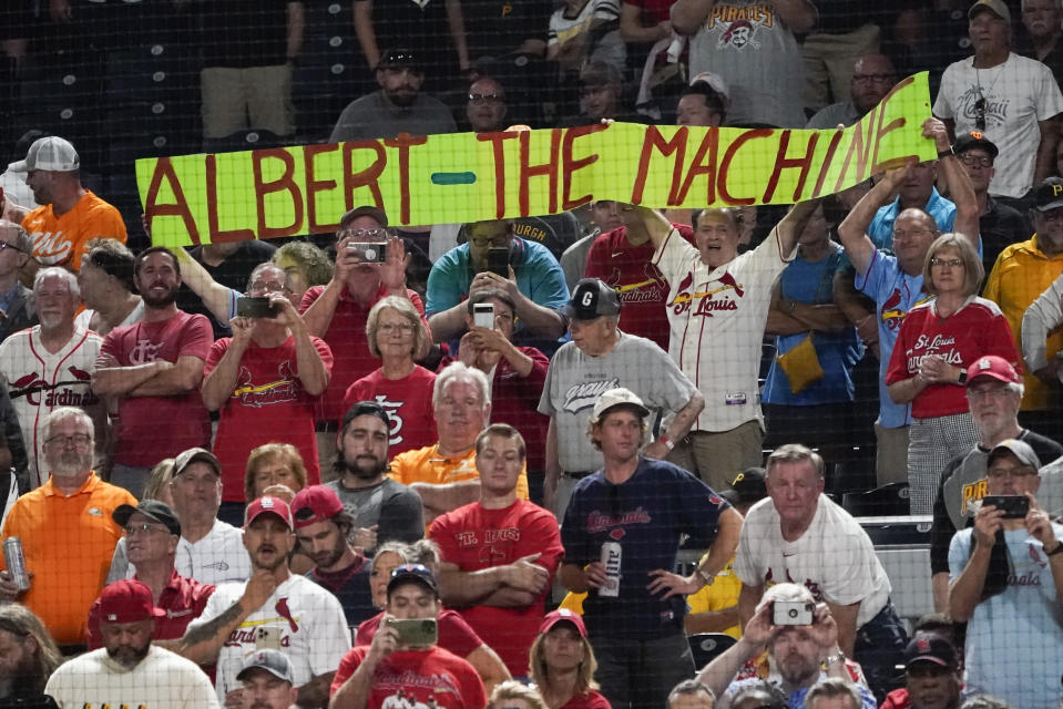 St. Louis Cardinals fans hold up a sign for Albert Pujols as he comes to bat against the Pittsburgh Pirates during the eighth inning of a baseball game Friday, Sept. 9, 2022, in Pittsburgh. (AP Photo/Keith Srakocic)