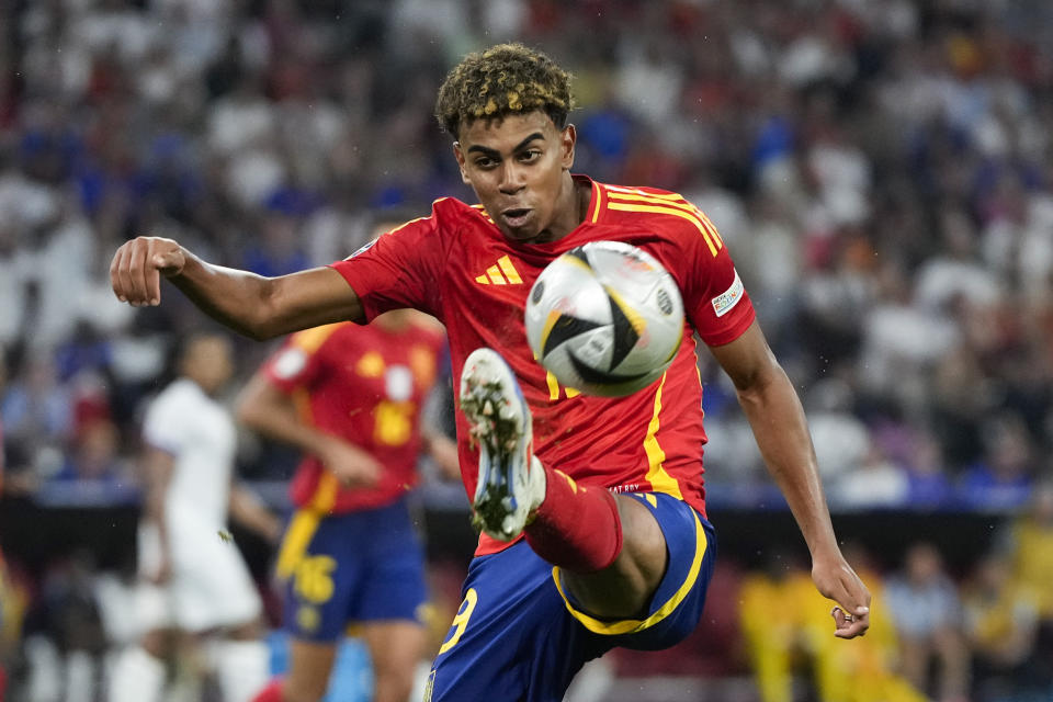 Spain's Lamine Yamal controls the ball during a semifinal match between Spain and France at the Euro 2024 soccer tournament in Munich, Germany, Tuesday, July 9, 2024. (AP Photo/Antonio Calanni)