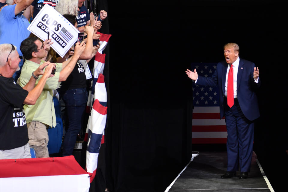 TOPSHOT - US President Donald Trump arrives for a campaign rally at the BOK Center on June 20, 2020 in Tulsa, Oklahoma. - Hundreds of supporters lined up early for Donald Trump's first political rally in months, saying the risk of contracting COVID-19 in a big, packed arena would not keep them from hearing the president's campaign message. (Photo by Nicholas Kamm / AFP) / ALTERNATE CROP (Photo by NICHOLAS KAMM/AFP via Getty Images)