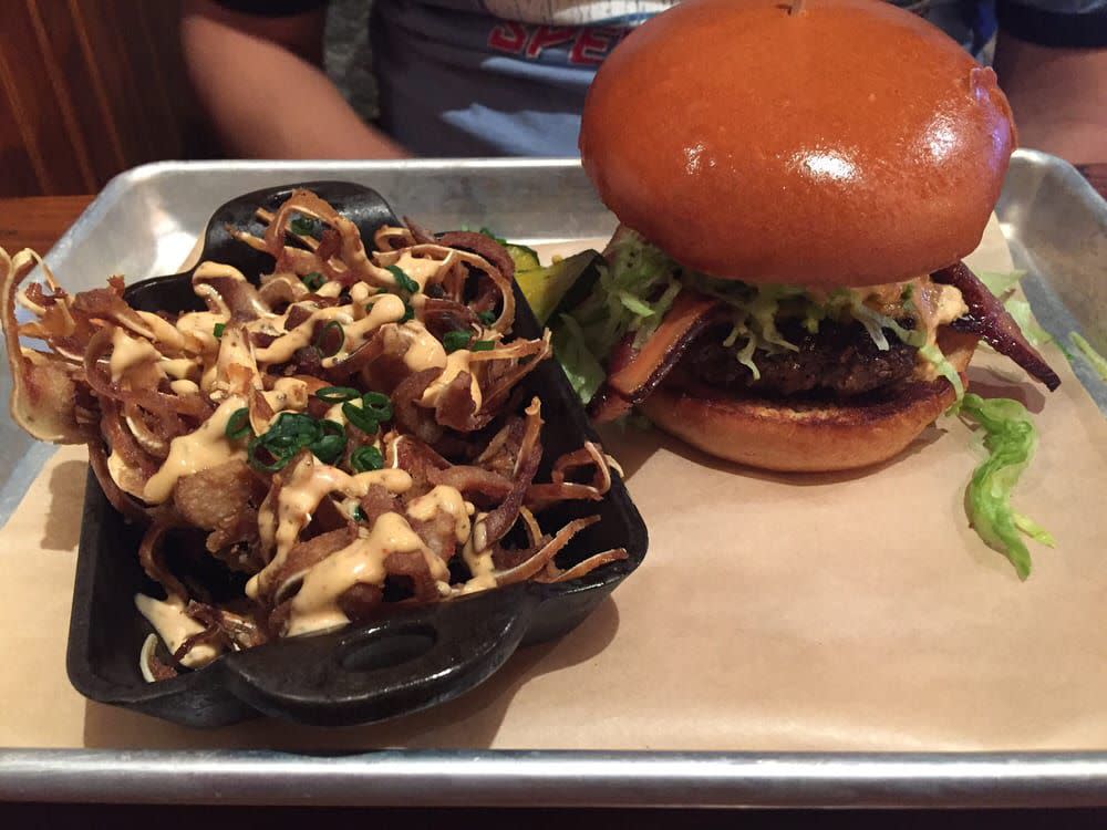 crispy pig ears and a burger from wrecking bar brewpub