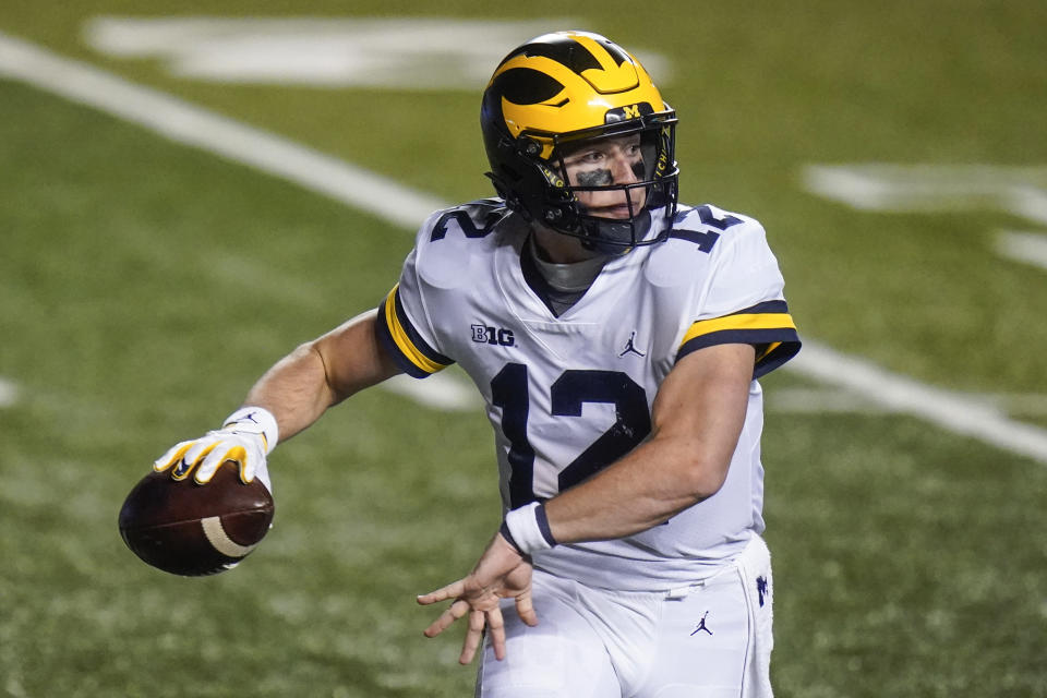 Michigan's Cade McNamara throws a pass during the second half of an NCAA college football game against Rutgers on Saturday, Nov. 21, 2020, in Piscataway, N.J. Michigan won 48-42. (AP Photo/Frank Franklin II)