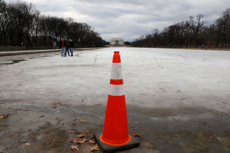 Lincoln Memorial is seen with an icy reflecting pool in Washington, U.S., on the second day of Government shutdown, January 21, 2018. REUTERS/Yuri Gripas