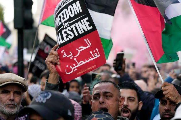 Protesters attend a pro Palestinian demonstration in London, Saturday, Oct. 14, 2023