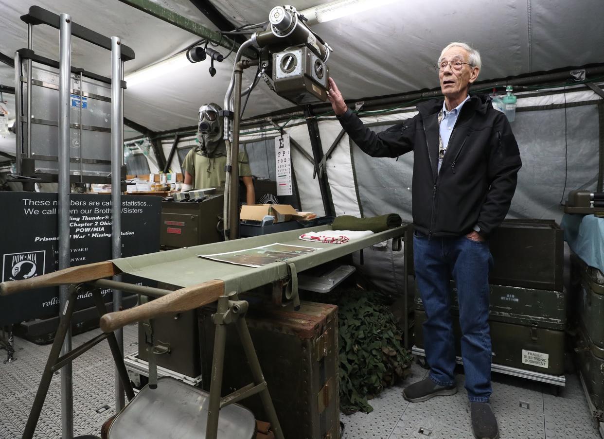 Vietnam War veteran Ted Mathies, 75, talks about the X-ray machine in his tent at the Medic’s Corner at MAPS Air Museum in Green. The 1940s model is similar to one that he operated as a U.S. Army combat medic.
