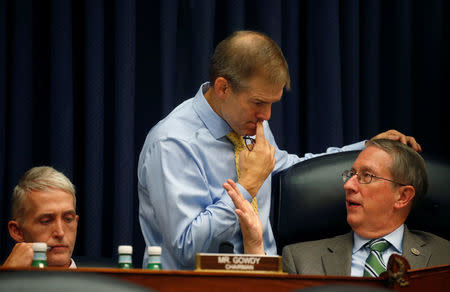 Rep. Jim Jordan (R-OH) (C), talks with Rep. Bob Goodlatte, the Republican chairman of the House Judiciary Committee as Rep. Trey Gowdy (R-SC) (L) listens as FBI Deputy Assistant Director Peter Strzok testifies before the House Committees on Judiciary and Oversight and Government Reform joint hearing on "Oversight of FBI and DOJ Actions Surrounding the 2016 Election" in the Rayburn House Office Building in Washington, U.S., July 12, 2018. REUTERS/Leah Millis