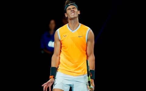 Spain's Rafael Nadal reacts after a point against Serbia's Novak Djokovic during the men's singles final on day 14 of the Australian Open tennis tournament in Melbourne on January 27, 2019 - Credit: AFP