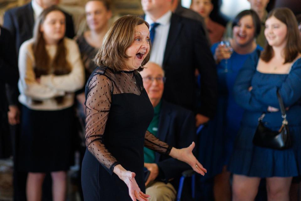 Cindy Van Laeys reacts to finding out the "surprise birthday" was a surprise wedding ceremony for her son, Friday, March 29, 2024, at Wynridge Farms in York Township.
