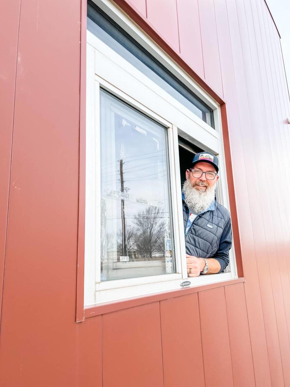 Reverie Coffee Roasters owner Andrew Gough poses at his newest venture: a new Reverie Roasters Express in northeast Wichita.