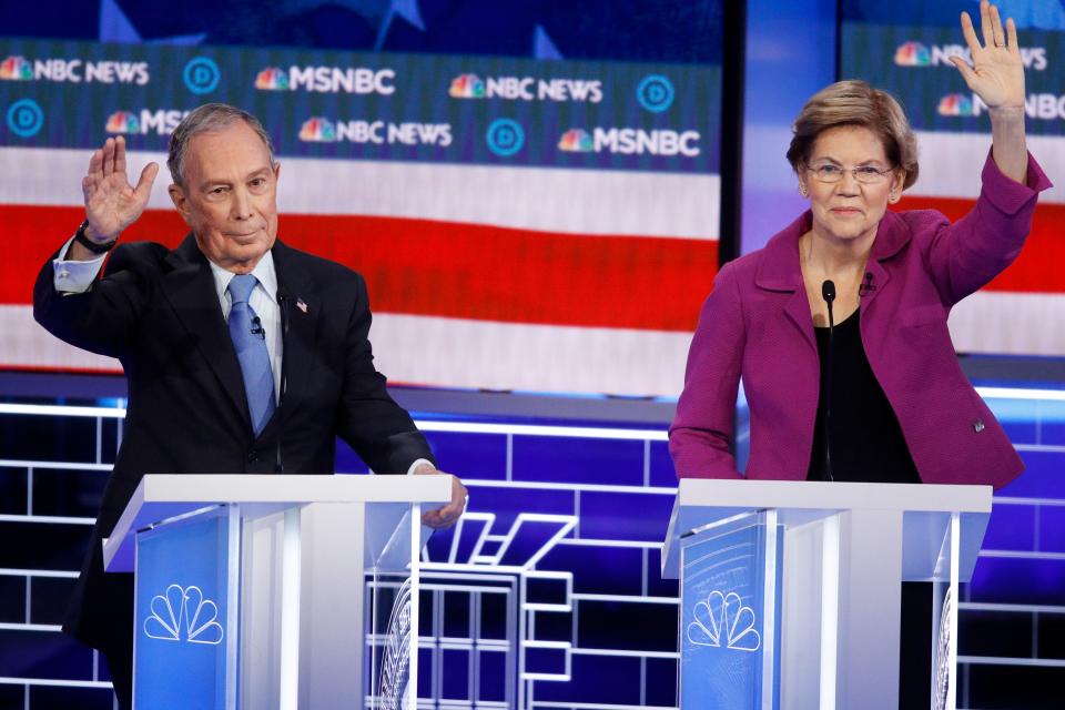 Former New York Mayor Mike Bloomberg and Sen. Elizabeth Warren (D-Mass.) try to get in their time at the Democratic presidential primary debate Wednesday in Las Vegas. (John Locher/ASSOCIATED PRESS)