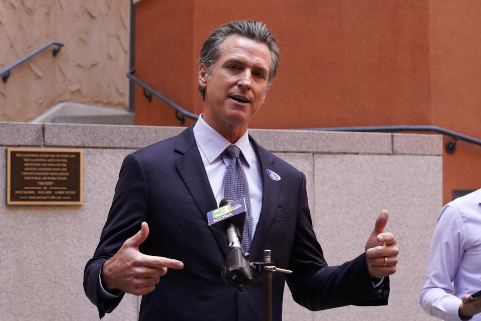 California Gov. Gavin Newson responds to a question while meeting with reporters after casting his recall ballot at a voting center in Sacramento, Calif., Friday, Sept. 10, 2021. The last day to vote in the recall election is Tuesday Sept. 14. A majority of voters must mark "no" on the recall to keep Newsom in office. (AP Photo/Rich Pedroncelli)