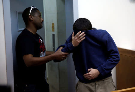 FILE PHOTO: An U.S.-Israeli teen who was arrested in Israel on suspicion of making bomb threats against Jewish community centres in the United States, Australia and New Zealand over the past three month, is seen before the start of a remand hearing at Magistrate's Court in Rishon Lezion, Israel March 23, 2017. REUTERS/Baz Ratner/File Photo