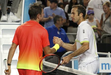 Switzerland's Stan Wawrinka (L) shakes hands with Czech Republic's Radek Stepanek after Wawrinka won their second round match at the Australian Open tennis tournament at Melbourne Park, Australia, January 21, 2016. REUTERS/Brandon Malone