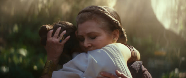 Leia, played by Carrie Fisher, embracing Rey, played by Daisy Ridley (Disney/Lucasfilm)