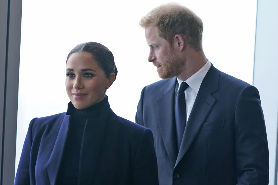 Meghan Markle and her husband, Prince Harry, arrive at the observatory at One World Trade in New York, Thursday, September 23, 2021. After months of speculation about whether they will be invited to the coronation, the palace announced that Harry will attend but that Meghan will remain in California with their two children.  (AP Photo/Seth Wenig, File)