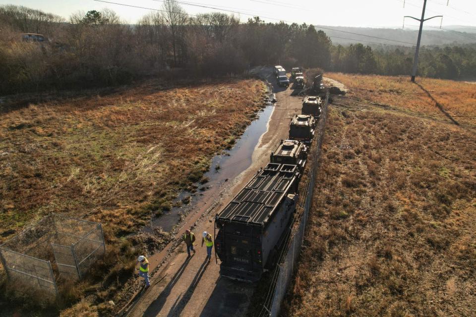 In this aerial view law enforcement and construction crews are seen at the planned site of a police training facility that activists have nicknamed ‘Cop City’ (AFP via Getty Images)