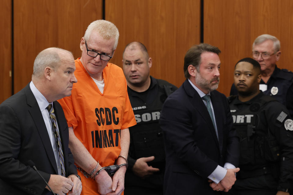 Alex Murdaugh, convicted of killing his wife, Maggie, and younger son, Paul, in June 2021, stands with his attorney Jim Griffin during a hearing on a motion for a retrial, Tuesday, Jan. 16, 2024, at the Richland County Judicial Center in Columbia, S.C. (Tracy Glantz/The State via AP, Pool)