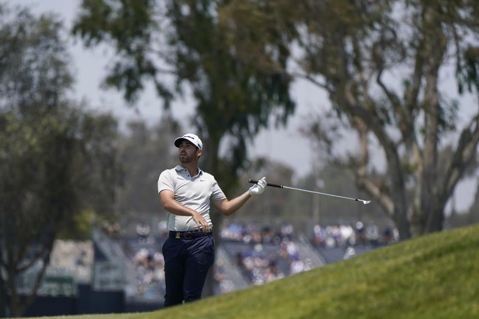 Matthew Wolff watches his shot from the seventh fairway during the first round of the U.S. Open Golf Championship, Thursday, June 17, 2021, at Torrey Pines Golf Course in San Diego. (AP Photo/Gregory Bull)