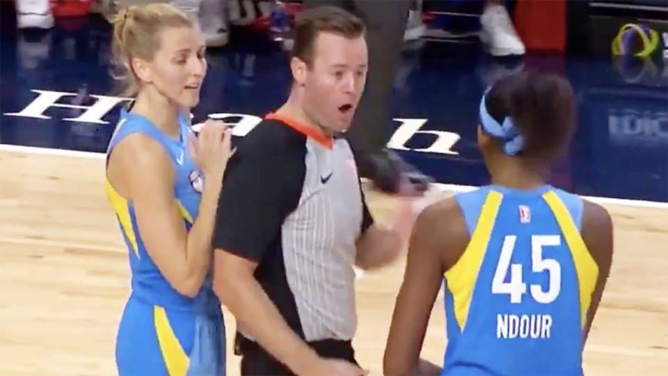 Chicago Sky centre Astou Ndour, right, was ejected by referee Kevin Fahy, middle, after the two collided in what has been described as an 'overreaction'.