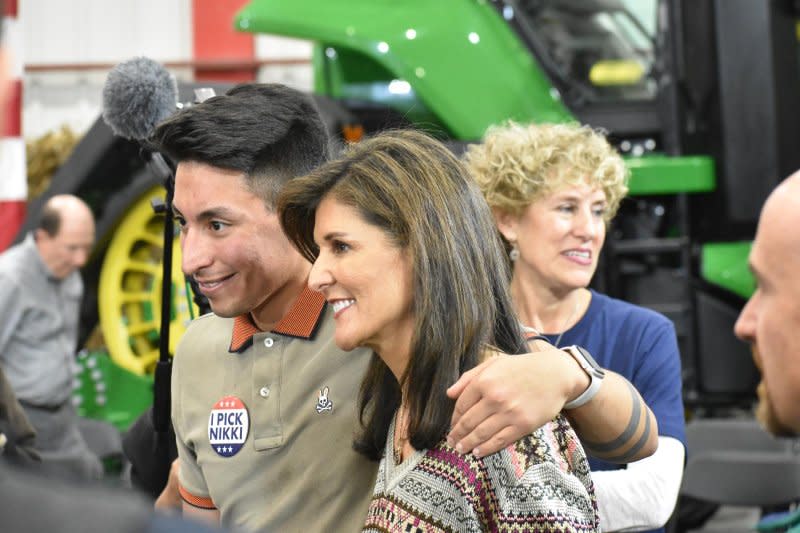 Republican presidential candidate Nikki Haley poses for photos with supporters at a town hall in Waukee, Iowa, on Sunday. Photo by Joe Fisher/UPI