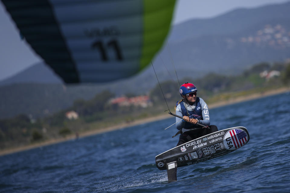 FILE - U.S. Olympic sailing team member Daniela Moroz kiteboards during a training session in Hyeres, southern France, Monday, April 29, 2024. Fans looking for something different at the Olympics might want to check out kitesurfing. But don’t blink — it’s the fastest sport in the Summer Games. (AP Photo/Daniel Cole, File)