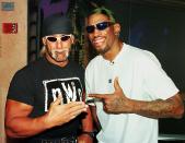 BEVERLY HILLS, UNITED STATES: Professional basketball player Dennis Rodman (R) of the Chicago Bulls poses with World Champion Professional wrestler Hollywood Hulk Hogan (L) following a press conference to announce 18 June that Karl Malone of the Utah Jazz and Rodman will wrestle each other in San Diego at the "Bash At The Beach" professional wrestling extravaganza 12 July. Rodman (aka Rodzilla) will be paired with Hogan and Malone's partner will be Diamond Dallas Page. AFP PHOTO Mike NELSON (Photo credit should read MIKE NELSON/AFP via Getty Images)