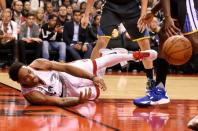 Dec 5, 2015; Toronto, Ontario, CAN; Toronto Raptors guard DeMar DeRozan (10) dives to retrieve a loose ball during the second half of the Raptors 112-109 loss to Golden State Warriors at Air Canada Centre. Mandatory Credit: Dan Hamilton-USA TODAY Sports