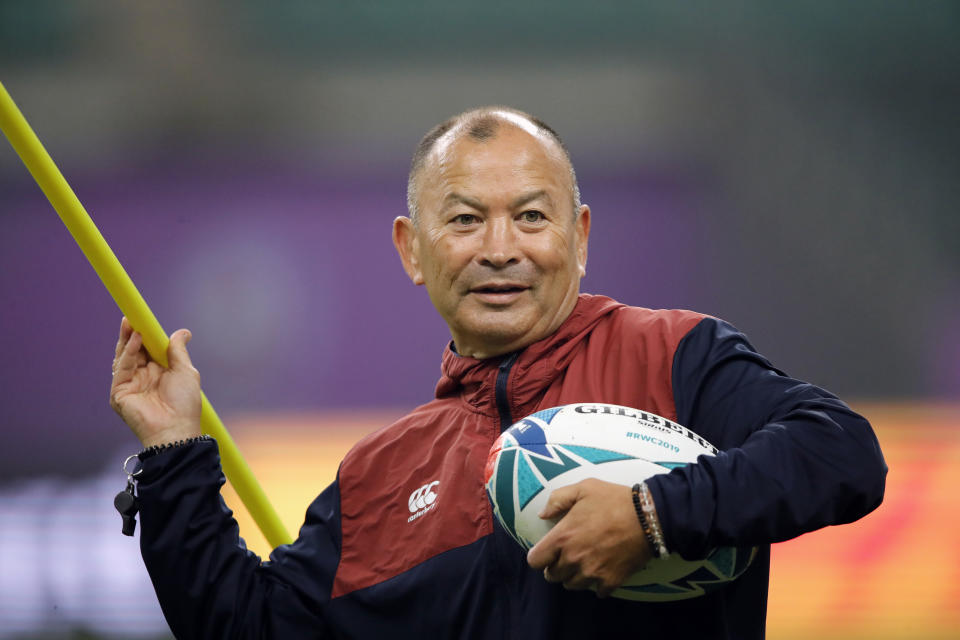 England's coach Eddie Jones throws a training pole during a training session in Oita, Japan, Friday, Oct. 18, 2019. England will face Australia in the quarterfinals at the Rugby World Cup on Oct. 19. (AP Photo/Christophe Ena)