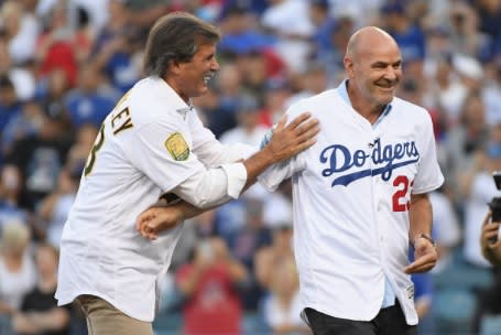 Dennis Eckersley and Kirk Gibson reunited for the first pitch at World Series Game 4. (Getty Images)