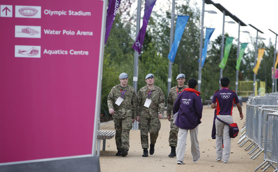 British military personnel walk through the Olympic Park ahead of the 2012 Summer Olympics, Sunday, July 15, 2012, in London. (AP Photo/Jae Hong)