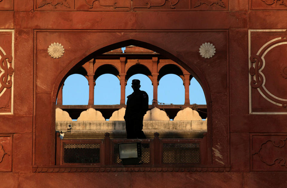 A soldier stands guard at the Badshahi Mosque in Lahore