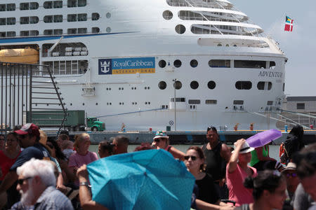 People line up to board a Royal Caribbean cruise ship that will take them to the U.S. mainland, in San Juan, Puerto Rico September 28, 2017. REUTERS/Alvin Baez