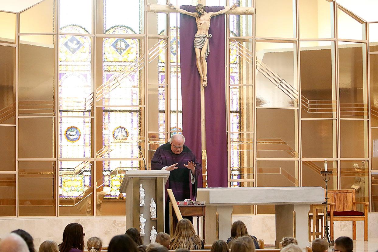 The Rev. Rod Kreidler blesses the ashes at the Ash Wednesday Mass at St. Edward Church on Wednesday, March 2, 2022 . TOM E. PUSKAR/TIMES-GAZETTE.COM
