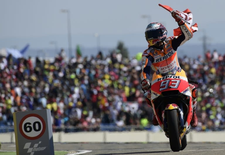 Honda's Spanish rider Marc Marquez celebrates after winning the Moto Grand Prix of Aragon at the Motorland circuit in Alcaniz, Spain on September 24, 2017