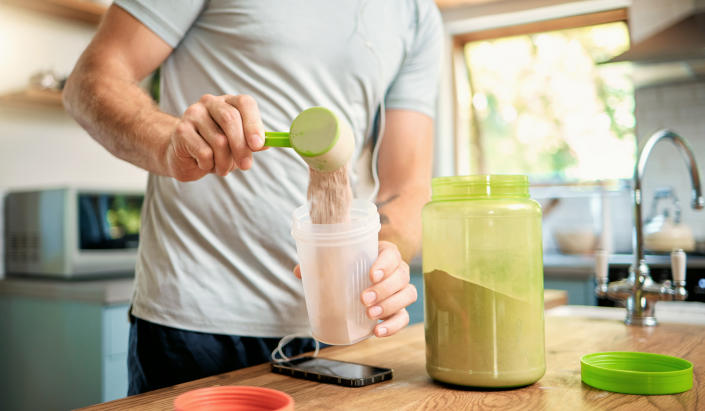 A man making a replacement meal shake.