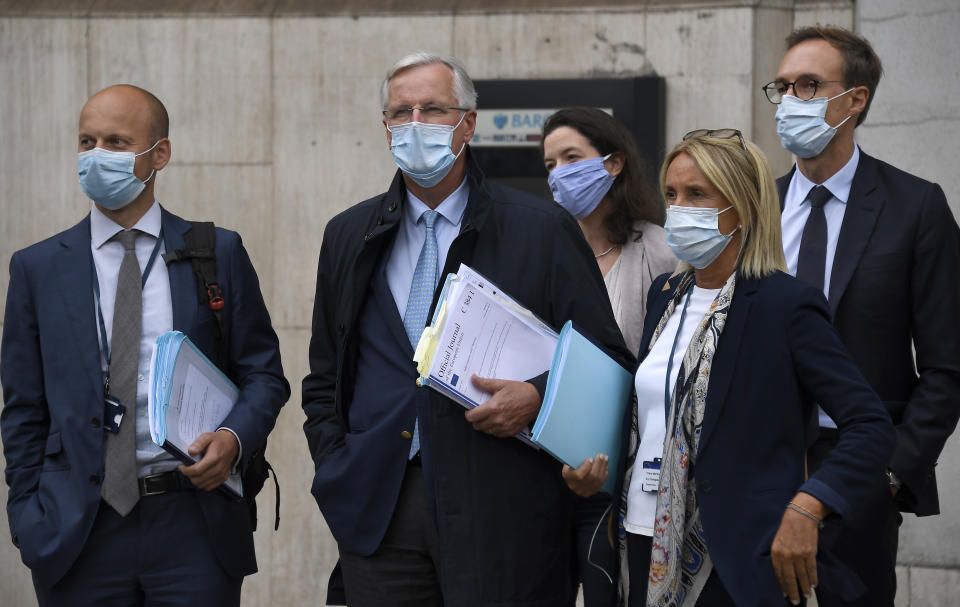 EU Chief negotiator Michel Barnier , second from left, arrives with his team at the Westminster Conference Centre in London, Wednesday, Sept. 9, 2020. UK and EU officials begin the eighth round of Brexit negotiations in London. (AP Photo/Alberto Pezzali)