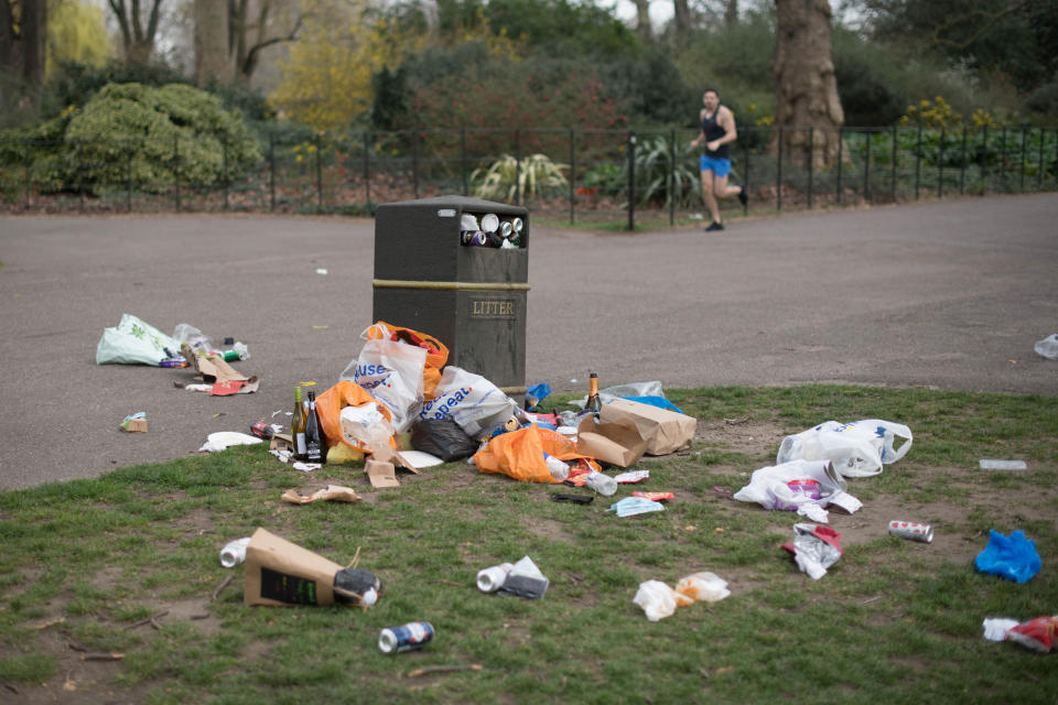 Bins overflow with rubbish in Battersea Park in south London after yesterday's record breaking warm weather. Picture date: Wednesday March 31, 2021. The UK may be about to experience its hottest March on record with temperatures forecast to soar to around 25C (77F).