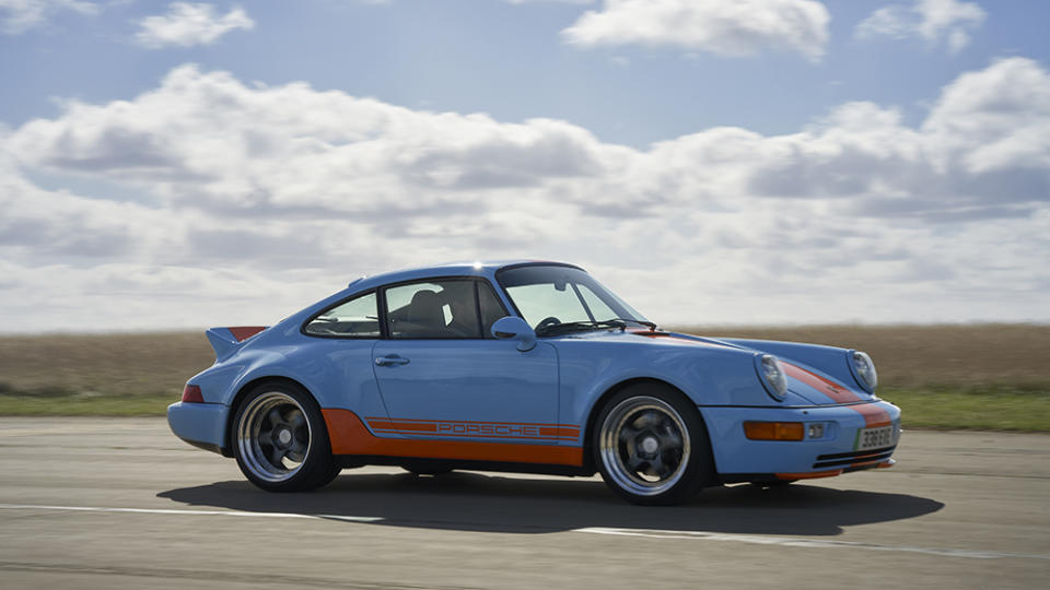 Writer Ben Oliver driving Everrati’s Porsche 911 (964) signature Gulf edition on the track