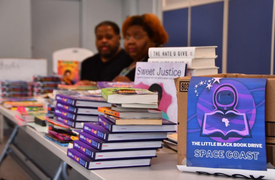 Organizers of the Little Black Book Drive sort through donated books that will be given out at at three locations for Juneteenth celebrations in Melbourne, Cocoa and Mims. The group collected over 2,000 books for children and young adults. Shown are JD Gallop, criminal justice reporter at FLORIDA TODAY, and Rolanda Hatcher-Gallop, a former FLORIDA TODAY editor.