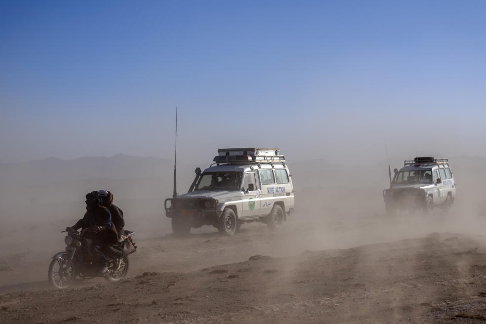 Afghans drive to the earthquake affected areas to help people affected by an earthquake in Zenda Jan district in Herat province, western of Afghanistan, Sunday, Oct. 8, 2023. Powerful earthquakes killed at least 2,000 people in western Afghanistan, a Taliban government spokesman said Sunday. It's one of the deadliest earthquakes to strike the country in two decades. (AP Photo/Ebrahim Noroozi)