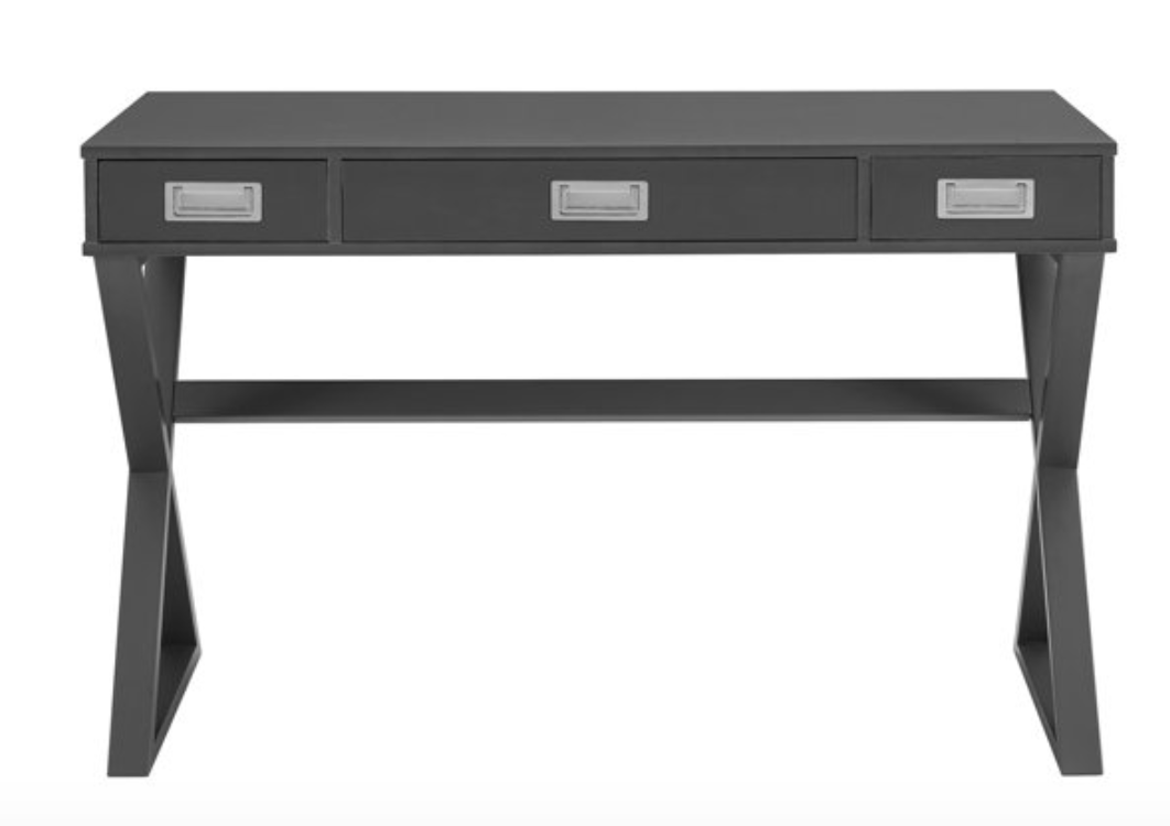 Charcoal colored campaign-style desk with X-legs and silver hardware on the 3 drawers. 