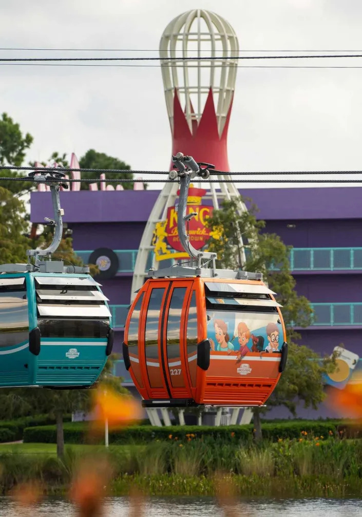 skyliner flying past the bowling ball walls at the pop century resort at disney world