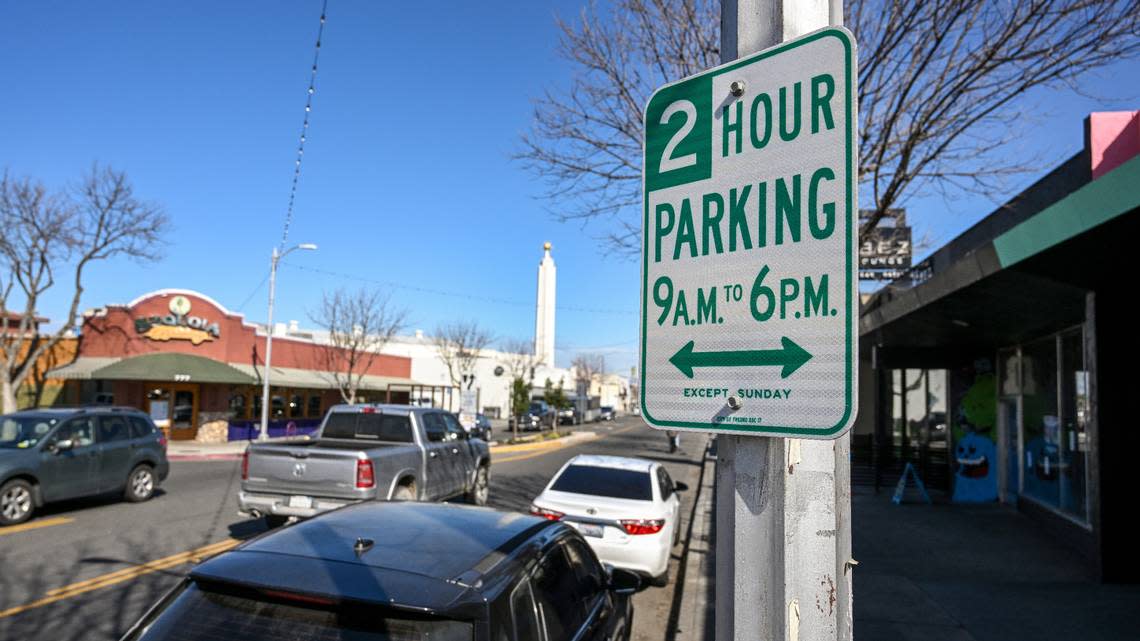 Two-hour parking signs have been posted on Olive Avenue near the Tower Theatre in Fresno’s Tower District.