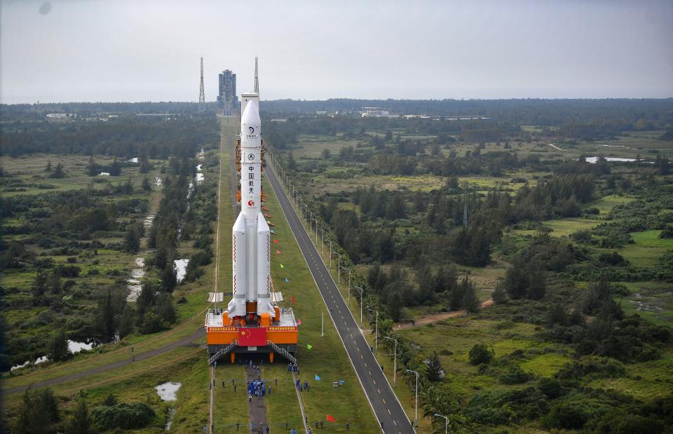 In this Nov. 17, 2020, photo released by China's Xinhua News Agency, a Long March-5 rocket is moved at the Wenchang Space Launch Site in Wenchang in southern China's Hainan Province.