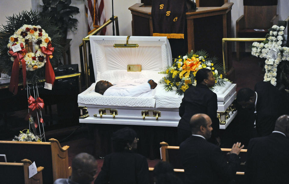 FILE - In this July 23, 2014, file photo, Eric Garner's body lies in a casket during his funeral at Bethel Baptist Church in the Brooklyn borough of New York. New York Attorney General Letitia James' inability to secure charges against Rochester police officers shown on video holding Daniel Prude to the pavement until he stopped breathing shows the difficulty in prosecuting officers who use deadly force. (Julia Xanthos/New York Daily News via AP, Pool, File)