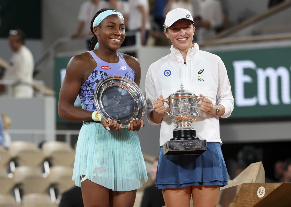 Coco Gauff and Iga Swiatek, pictured here with their trophies after the French Open final.