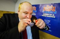 Geoff Stone poses for a picture as he pretends to smoke from a pipe following his audition for "Rob Ford The Musical: The Birth of a Ford Nation" in Toronto, June 16, 2014. Toronto Mayor Rob Ford, who shot to prominence last year after admitting to smoking crack, buying illegal drugs and driving after drinking, insisted for months he did not have a problem. But last month he said he would take time off to deal with his drinking issues. REUTERS/Mark Blinch (CANADA - Tags: POLITICS SOCIETY ENTERTAINMENT)